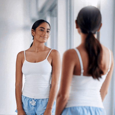 Confident woman showing smooth-looking skin